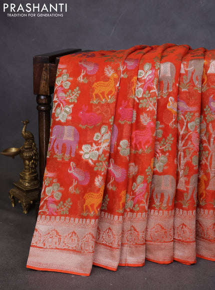 Art chiffon saree orange with allover mina weaves and woven border