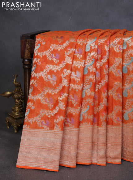 Art chiffon saree orange with allover zari & mina weaves and silver zari woven border