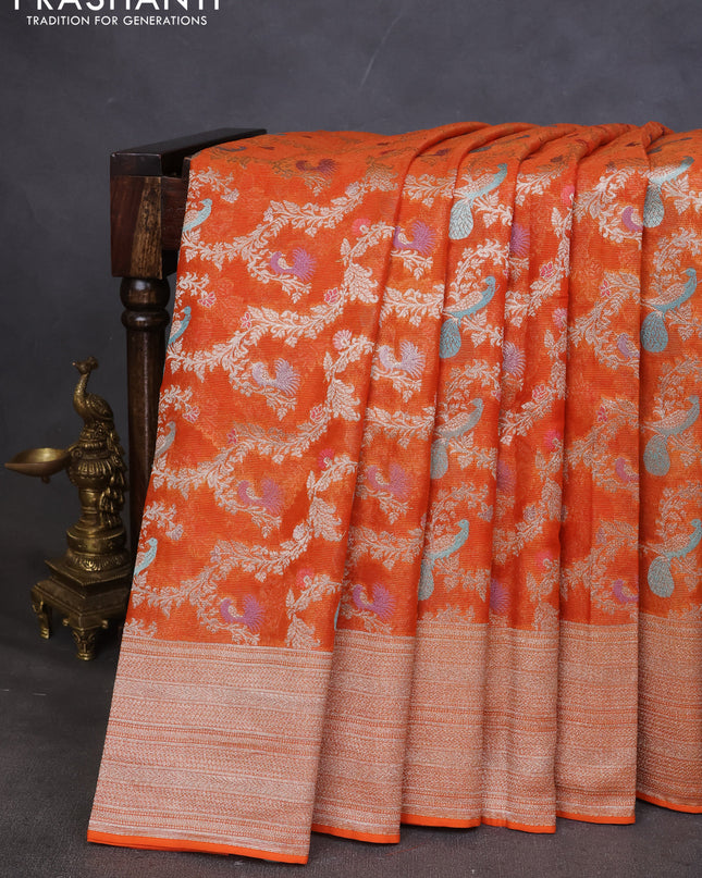 Art chiffon saree orange with allover zari & mina weaves and silver zari woven border
