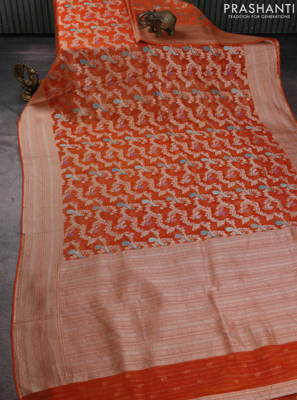 Art chiffon saree orange with allover zari & mina weaves and silver zari woven border