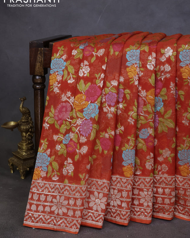 Art chiffon saree orange with allover mina weaves and woven border