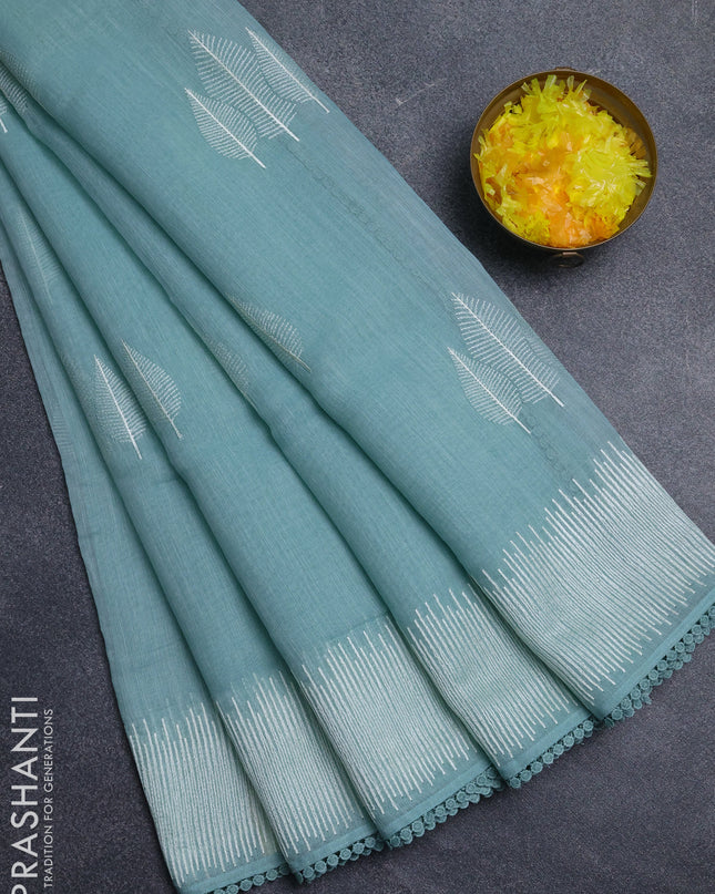Linen cotton saree teal shade with embroidery buttas and embroidered border