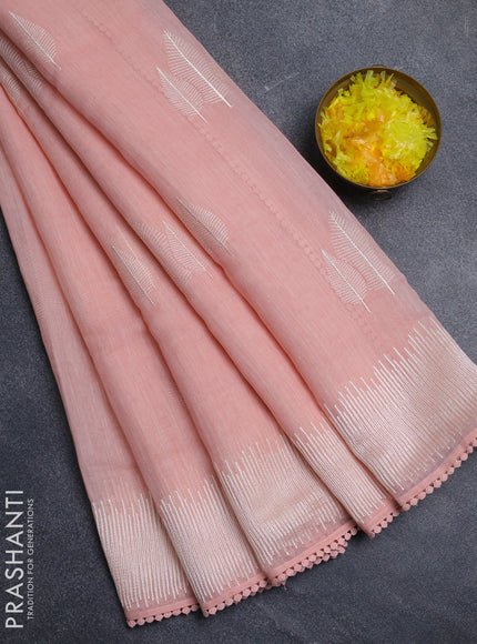 Linen cotton saree peach shade with embroidery buttas and embroidered border