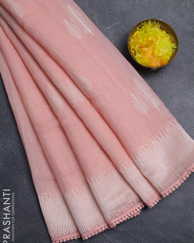 Linen cotton saree peach shade with embroidery buttas and embroidered border