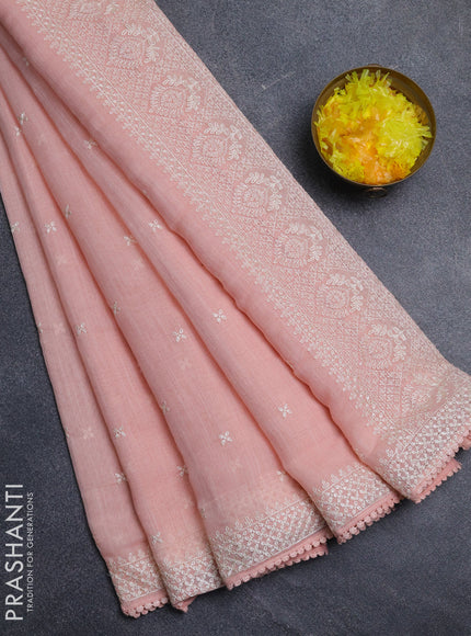 Linen cotton saree peach pink with embroidery buttas and embroidered border