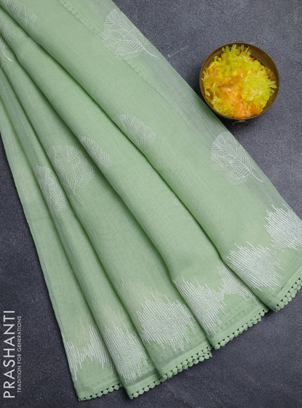 Linen cotton saree pista green with embroidery buttas and embroidered border