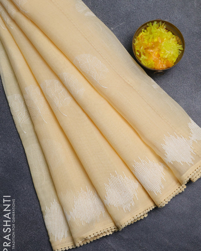 Linen cotton saree pale yellow with embroidery buttas and embroidered border