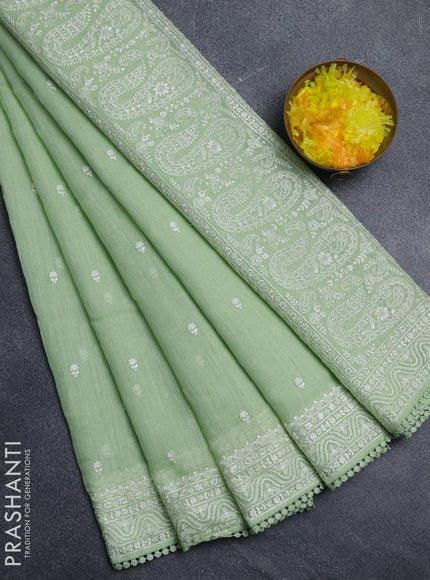 Linen cotton saree pista green with embroidery buttas and embroidered border