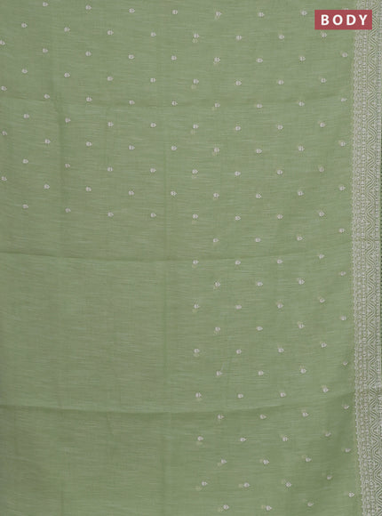 Linen cotton saree pista green with embroidery buttas and embroidered border