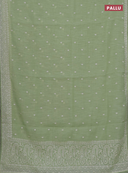 Linen cotton saree pista green with embroidery buttas and embroidered border