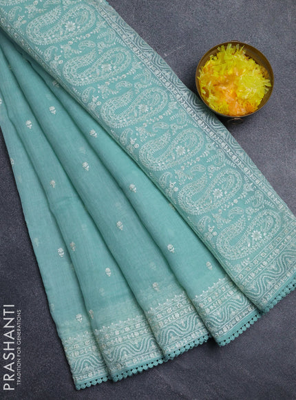 Linen cotton saree teal shade with embroidery buttas and embroidered border