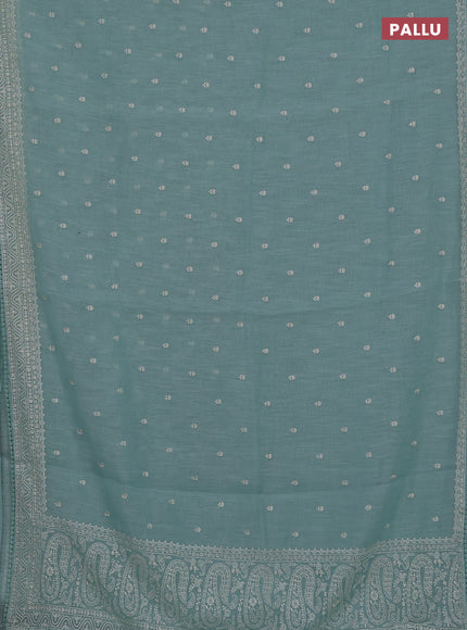 Linen cotton saree teal shade with embroidery buttas and embroidered border