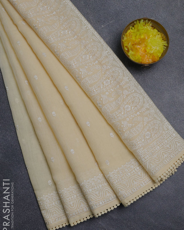 Linen cotton saree pale yellow with embroidery buttas and embroidered border
