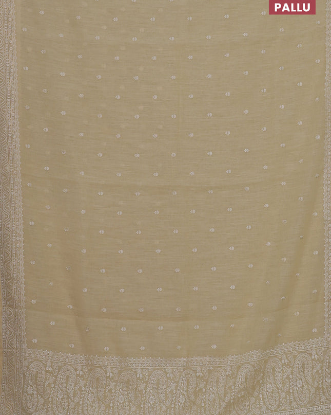 Linen cotton saree pale yellow with embroidery buttas and embroidered border