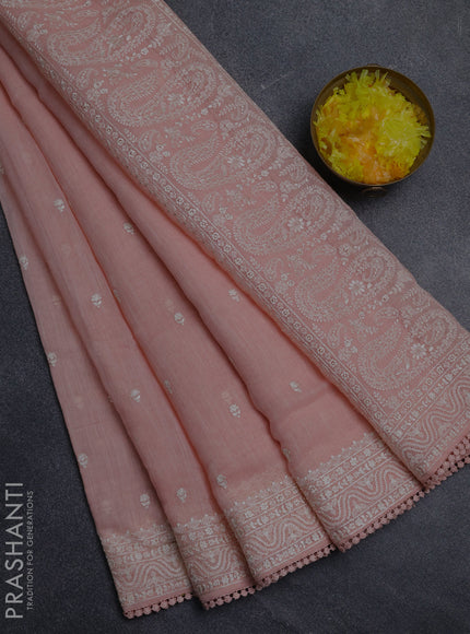 Linen cotton saree peach shade with embroidery buttas and embroidered border