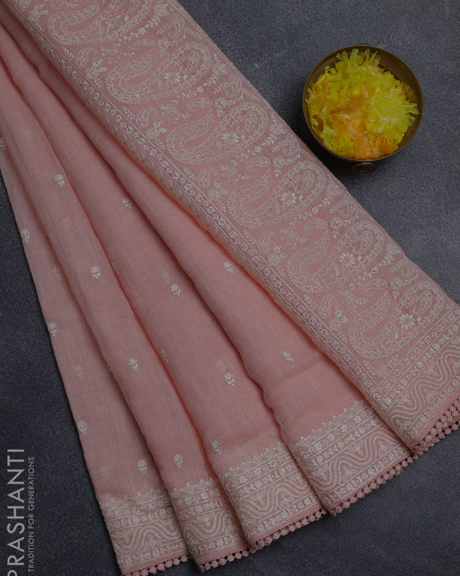 Linen cotton saree peach shade with embroidery buttas and embroidered border