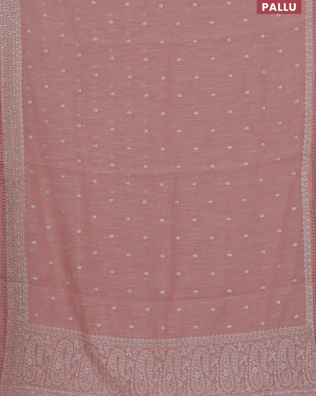 Linen cotton saree peach shade with embroidery buttas and embroidered border