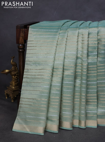 Tissue saree teal shade with silver & gold zari weaves and gottapatti work readymade blouse