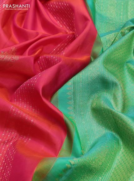 Pure kanchipuram silk saree dual shade of pinkish orange and teal green with zari weaves & buttas in borderless style