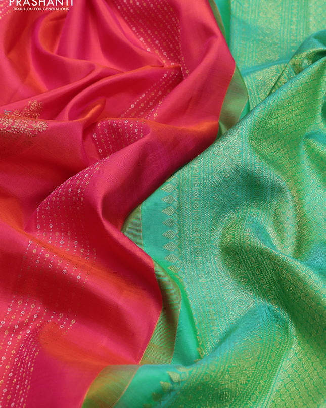Pure kanchipuram silk saree dual shade of pinkish orange and teal green with zari weaves & buttas in borderless style