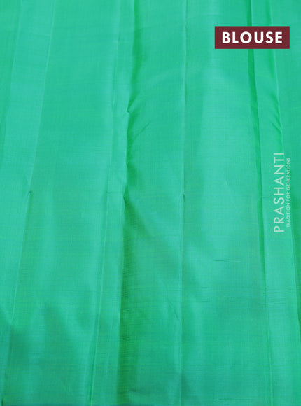 Pure kanchipuram silk saree dual shade of pinkish orange and teal green with zari weaves & buttas in borderless style