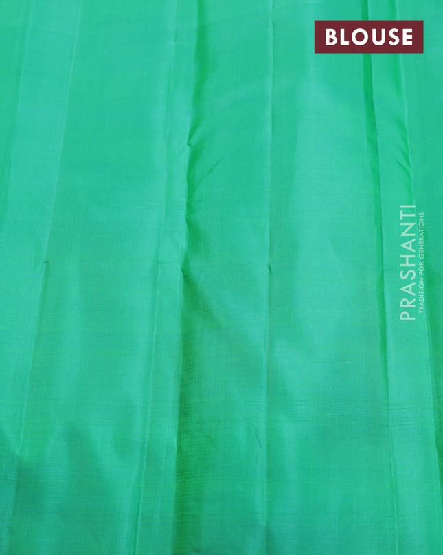 Pure kanchipuram silk saree dual shade of pinkish orange and teal green with zari weaves & buttas in borderless style