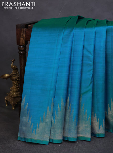 Pure kanchipuram silk saree teal blue with plain body and temple design zari woven border