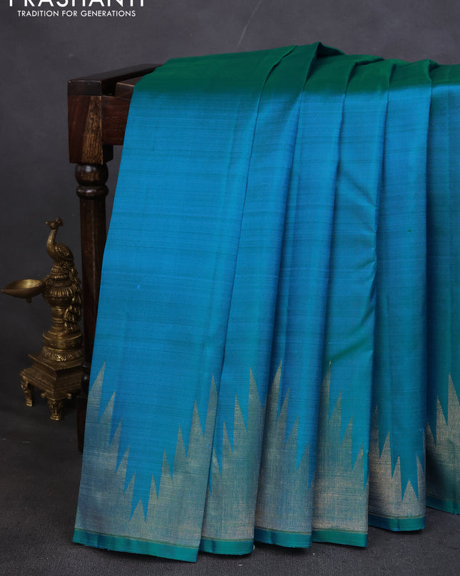 Pure kanchipuram silk saree teal blue with plain body and temple design zari woven border