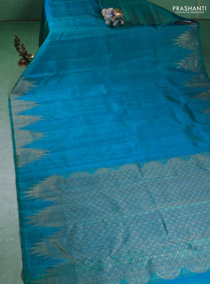 Pure kanchipuram silk saree teal blue with plain body and temple design zari woven border