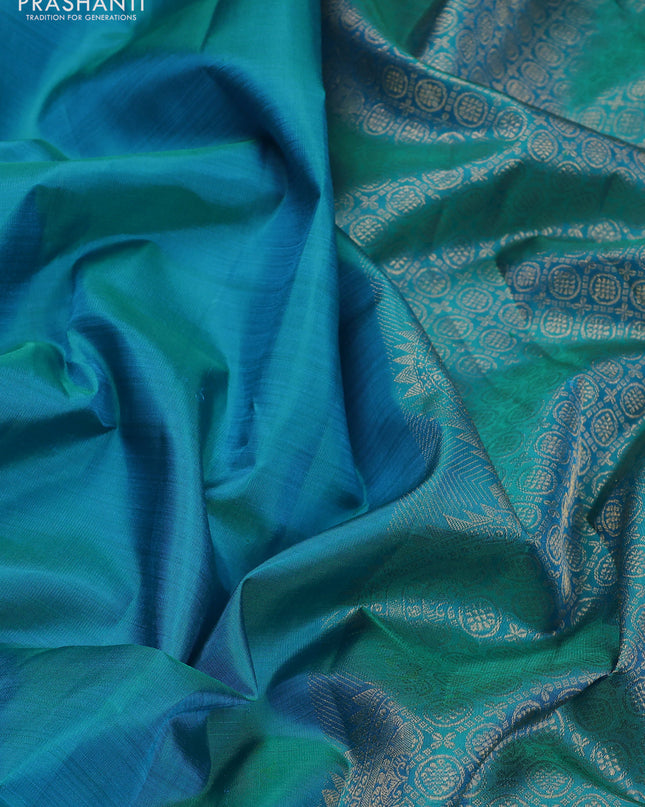 Pure kanchipuram silk saree teal blue with plain body and temple design zari woven border