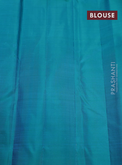 Pure kanchipuram silk saree teal blue with plain body and temple design zari woven border