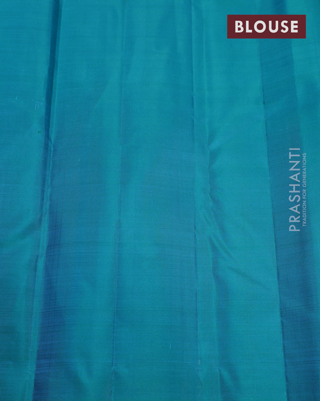 Pure kanchipuram silk saree teal blue with plain body and temple design zari woven border