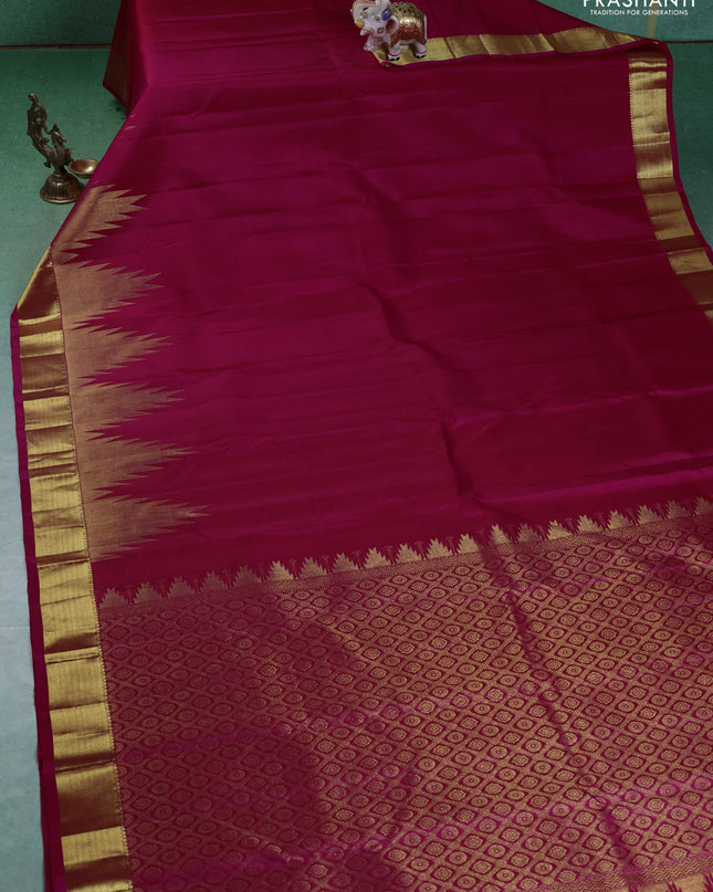 Pure kanchipuram silk saree pink with plain body and temple design zari woven border
