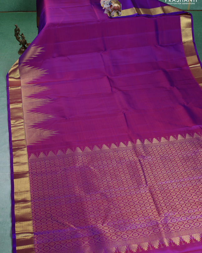 Pure kanchipuram silk saree purple with plain body and temple design zari woven border