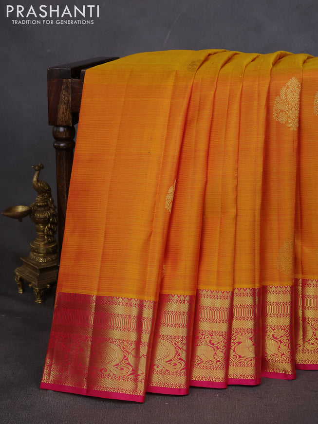 Pure kanchipuram silk saree mustard yellow and pink with allover zari weaves & buttas and zari woven border