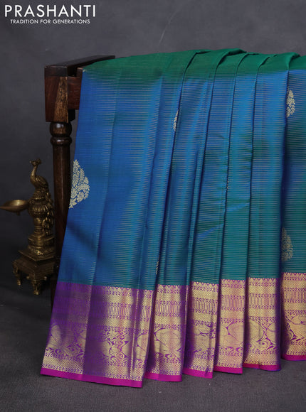 Pure kanchipuram silk saree dual shade of teal blue and purple with allover zari weaves & buttas and zari woven border