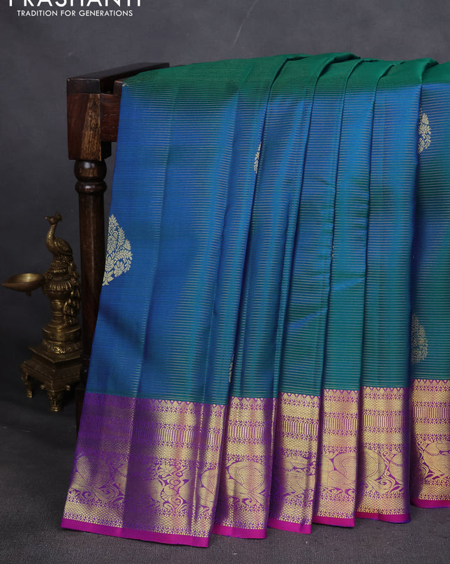 Pure kanchipuram silk saree dual shade of teal blue and purple with allover zari weaves & buttas and zari woven border