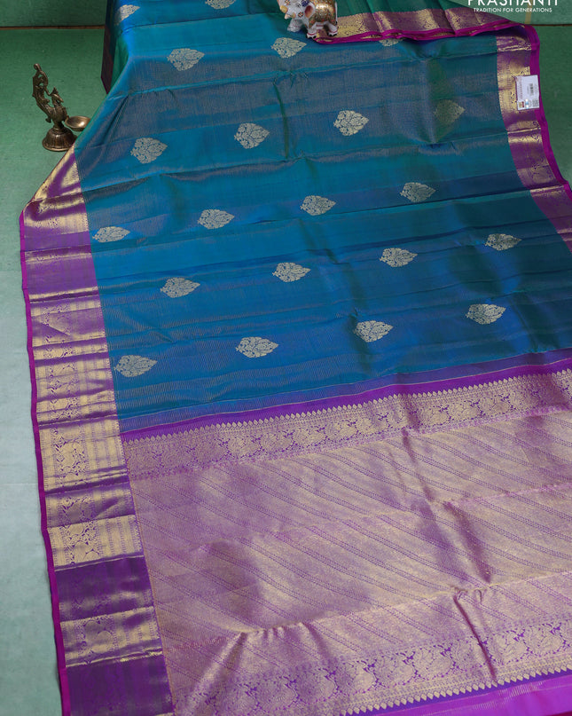 Pure kanchipuram silk saree dual shade of teal blue and purple with allover zari weaves & buttas and zari woven border