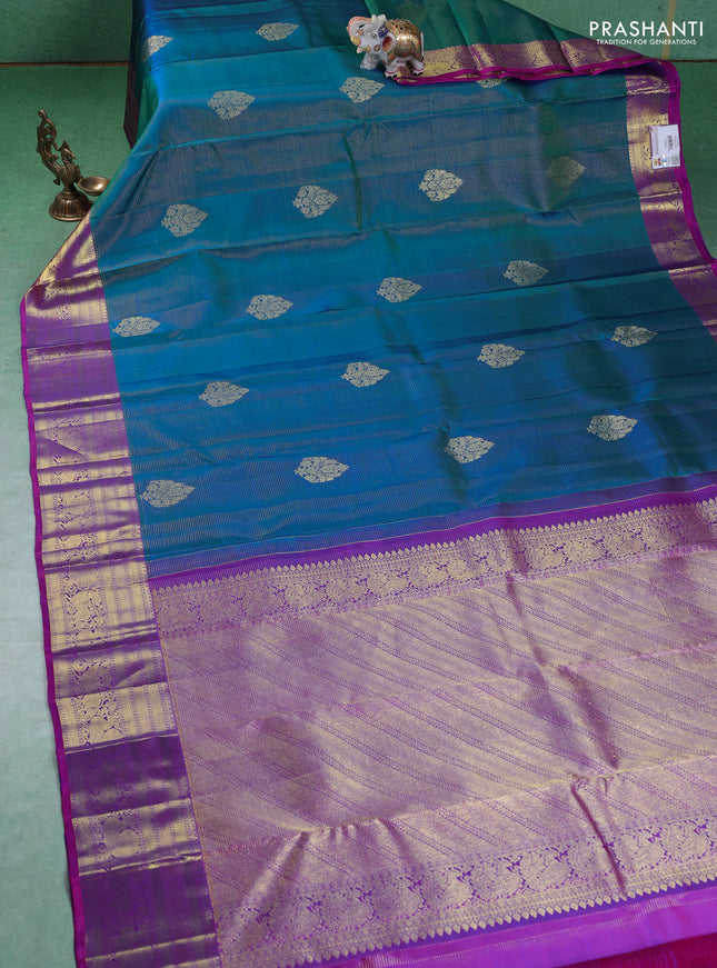 Pure kanchipuram silk saree dual shade of teal blue and purple with allover zari weaves & buttas and zari woven border