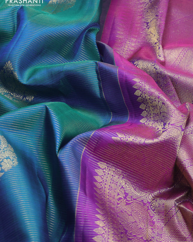 Pure kanchipuram silk saree dual shade of teal blue and purple with allover zari weaves & buttas and zari woven border