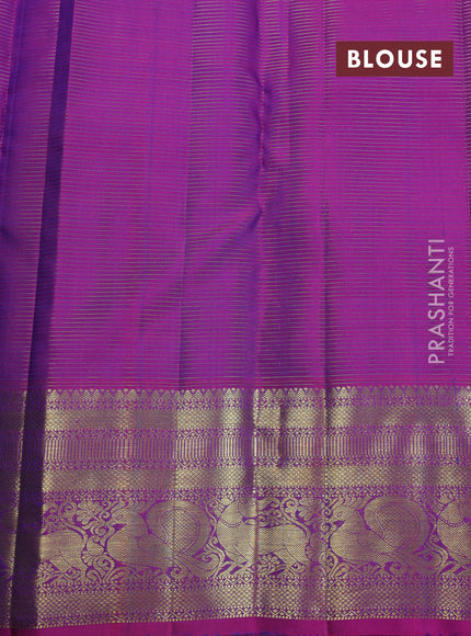 Pure kanchipuram silk saree dual shade of teal blue and purple with allover zari weaves & buttas and zari woven border