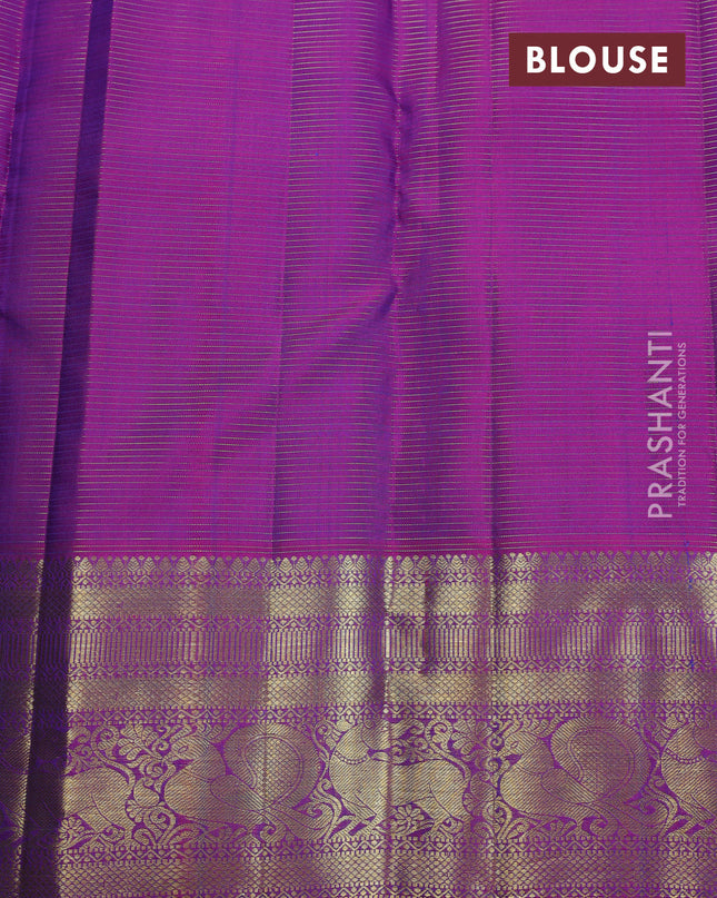 Pure kanchipuram silk saree dual shade of teal blue and purple with allover zari weaves & buttas and zari woven border