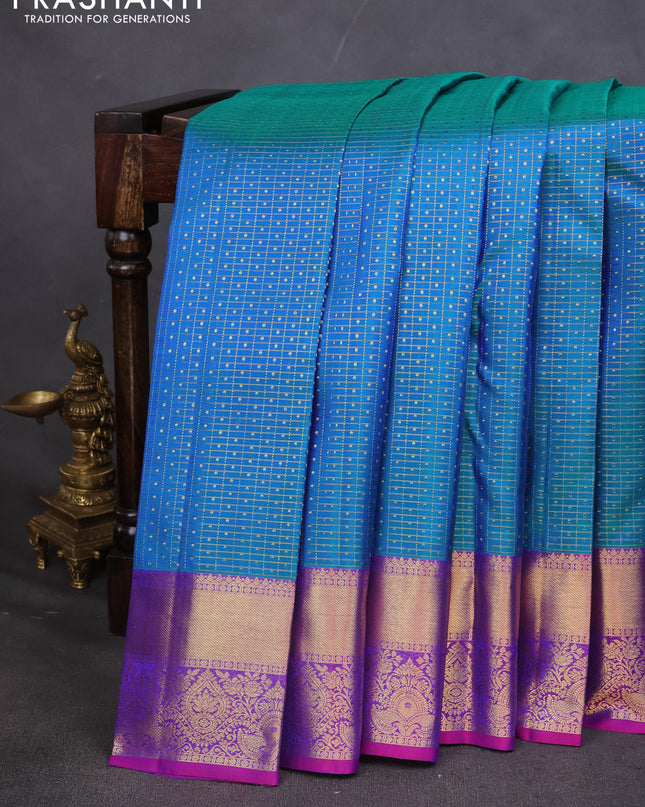 Pure kanchipuram silk saree dual shade of teal blue and orange with allover zari checks & lakshadeepam buttas and zari woven border