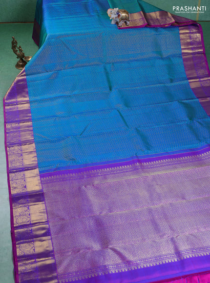 Pure kanchipuram silk saree dual shade of teal blue and orange with allover zari checks & lakshadeepam buttas and zari woven border