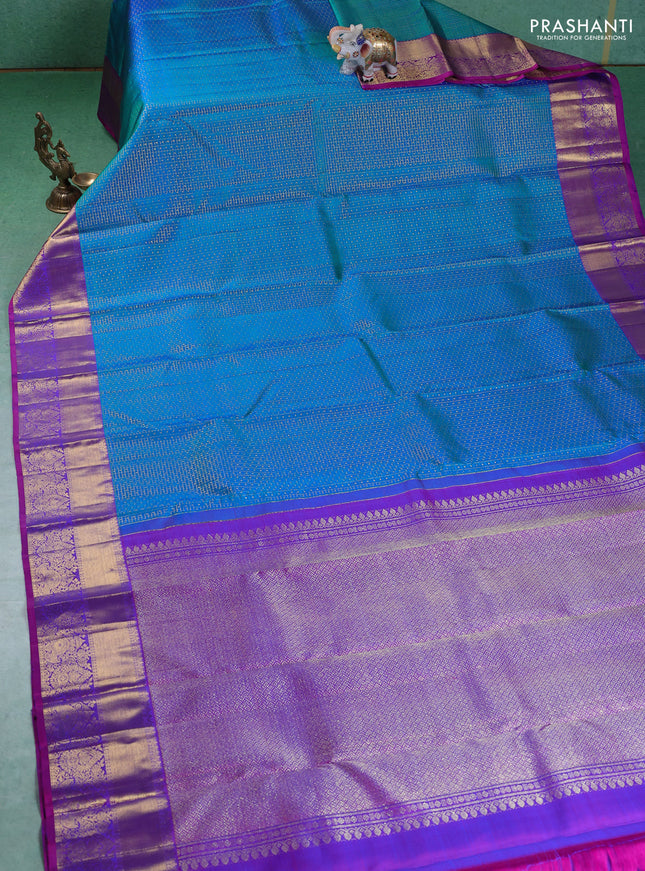 Pure kanchipuram silk saree dual shade of teal blue and orange with allover zari checks & lakshadeepam buttas and zari woven border