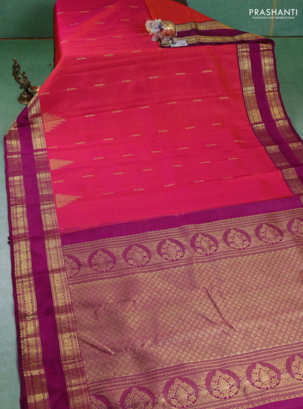 Pure kanchipuram silk saree dual shade of pinkish orange and purple with zari woven buttas and rettapet zari woven border