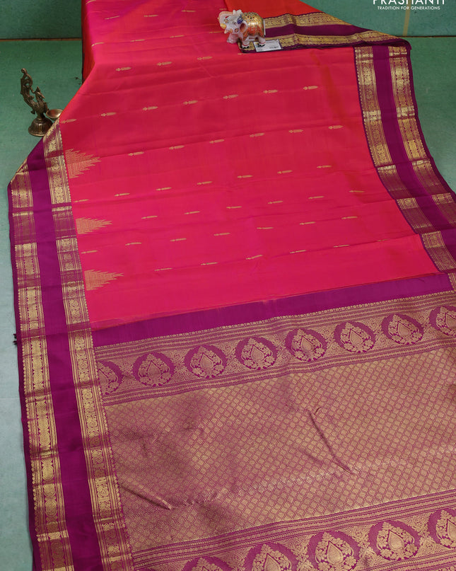 Pure kanchipuram silk saree dual shade of pinkish orange and purple with zari woven buttas and rettapet zari woven border