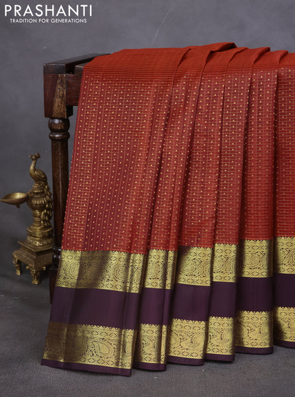 Pure kanchipuram silk saree rustic orange and deep wine with allover zari checks & lakshadeepam buttas and rettapet zari woven border