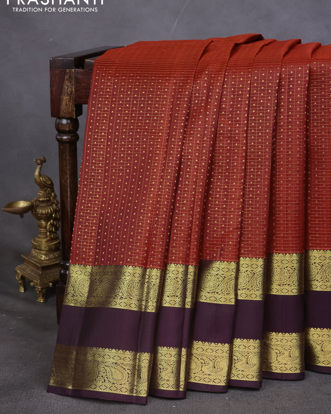 Pure kanchipuram silk saree rustic orange and deep wine with allover zari checks & lakshadeepam buttas and rettapet zari woven border