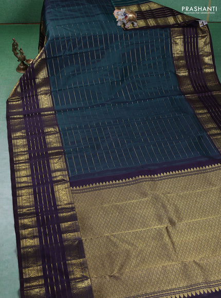 Pure kanchipuram silk saree peacock blue and deep wine with allover zari stripes pattern and long zari woven border